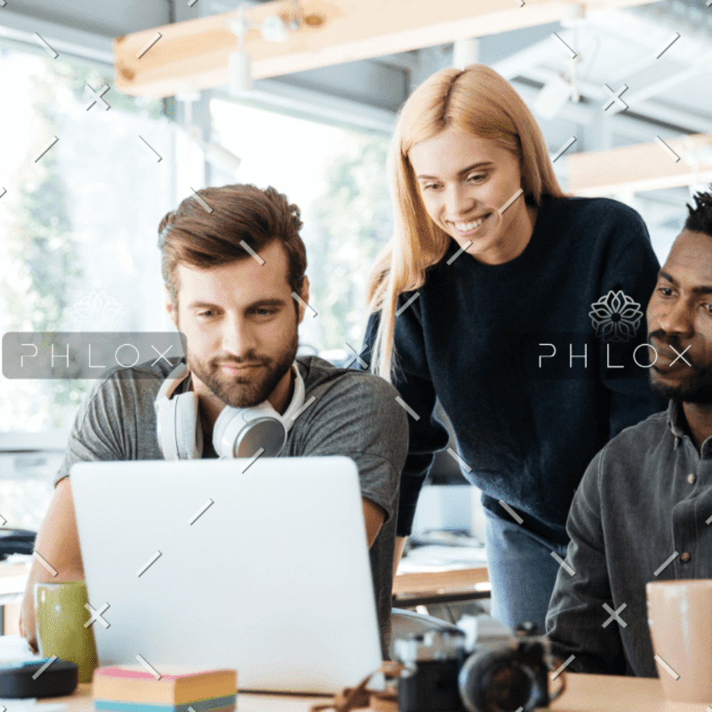 demo-attachment-944-happy-colleagues-sitting-in-office-coworking-PHYA6TG