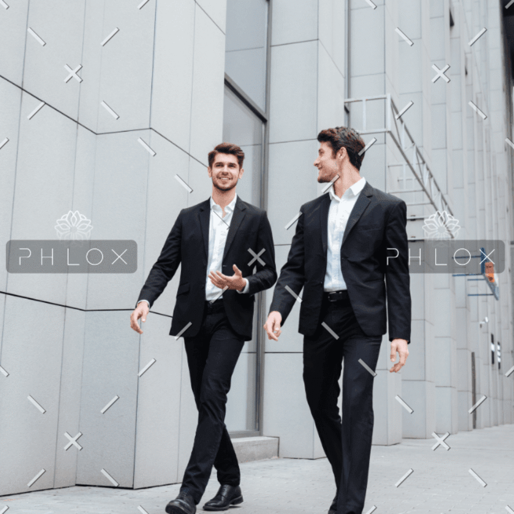 demo-attachment-922-two-businessmen-walking-and-talking-in-the-city-PMW8E26