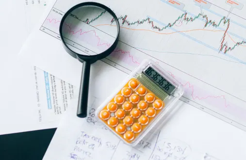 research data analysis with charts and magnifying glass